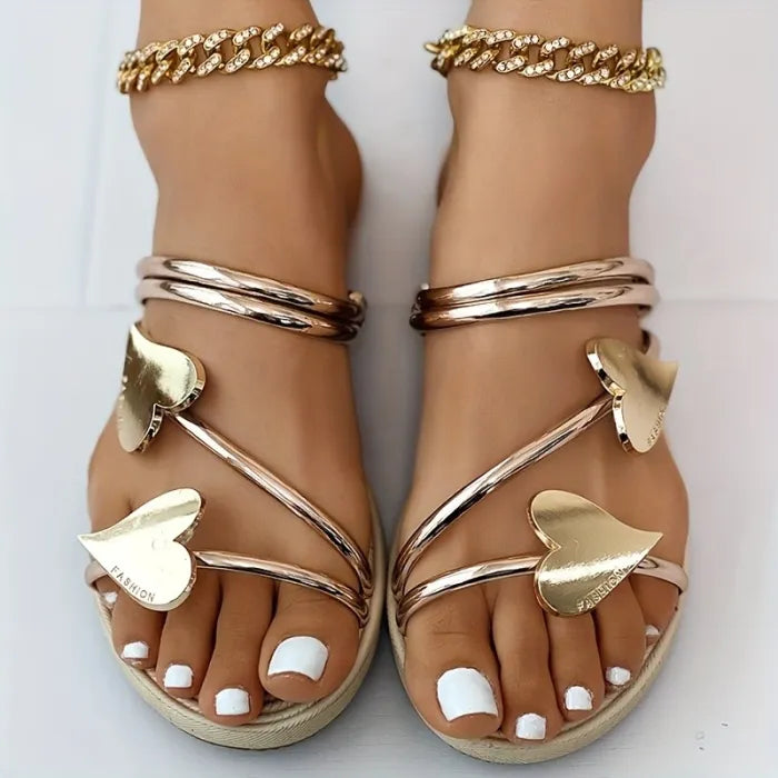 Elegant sandals with heart appliqués and metallic straps