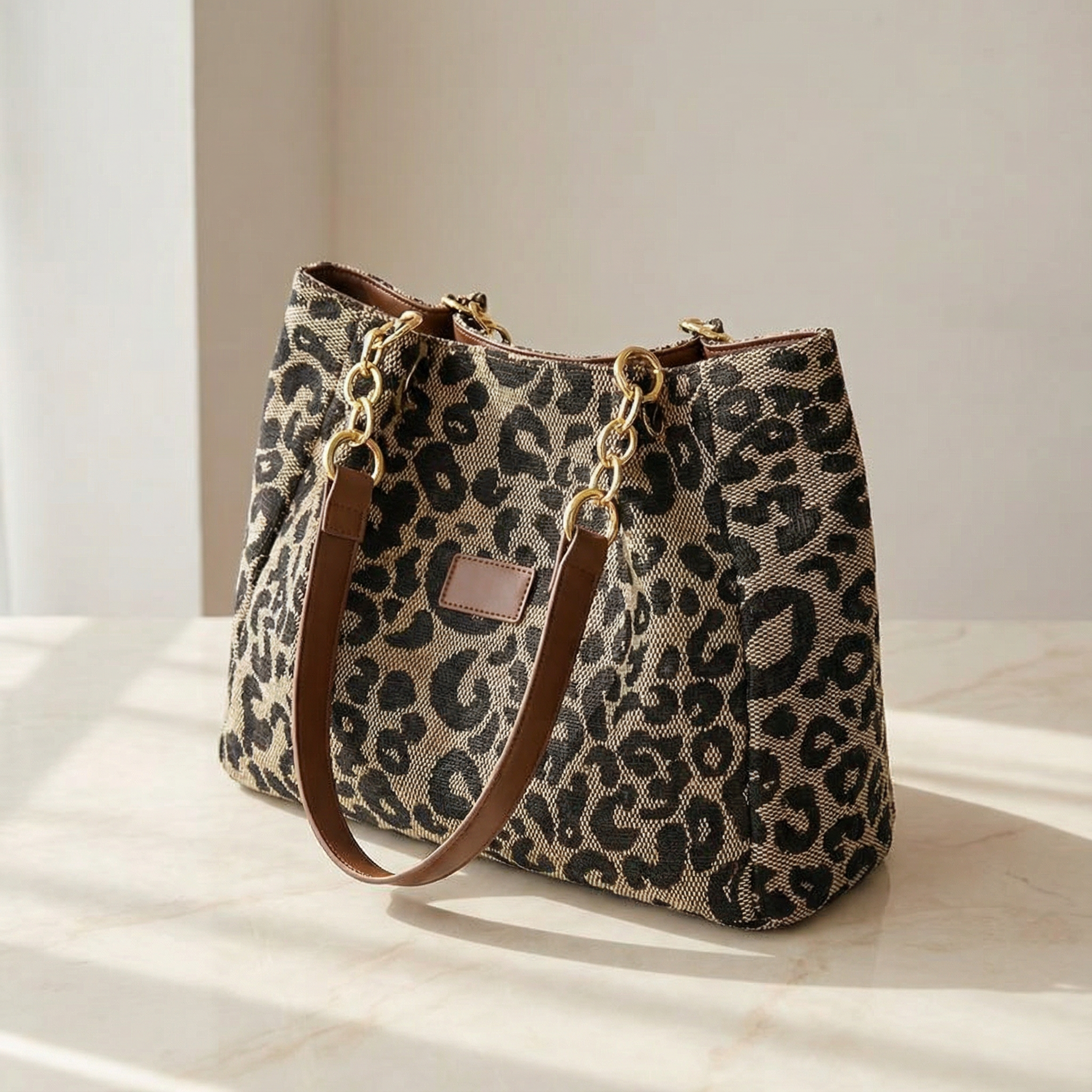Elegant leopard print pouches with gold chain