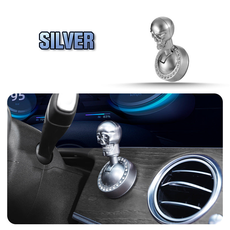 Metallic skull-design start button cover with rhinestones