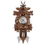 Traditional cuckoo clock with filigree embellishments