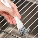 Grill cleaning brush with V-shaped head and scraper