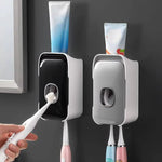 Wall-mounted toothpaste dispenser with adhesive installation