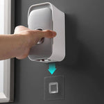 Wall-mounted toothpaste dispenser with adhesive installation