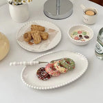 Elegant ceramic dinnerware with beaded rim design