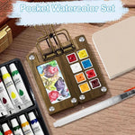 Kompaktes Aquarell-Set für unterwegs mit Palette, Pinsel und Skizzenbuch
