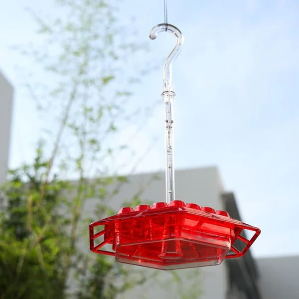 Hummingbird feeder with built-in ant moat