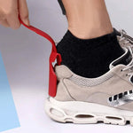 Practical shoehorn with clip function for effortless putting on