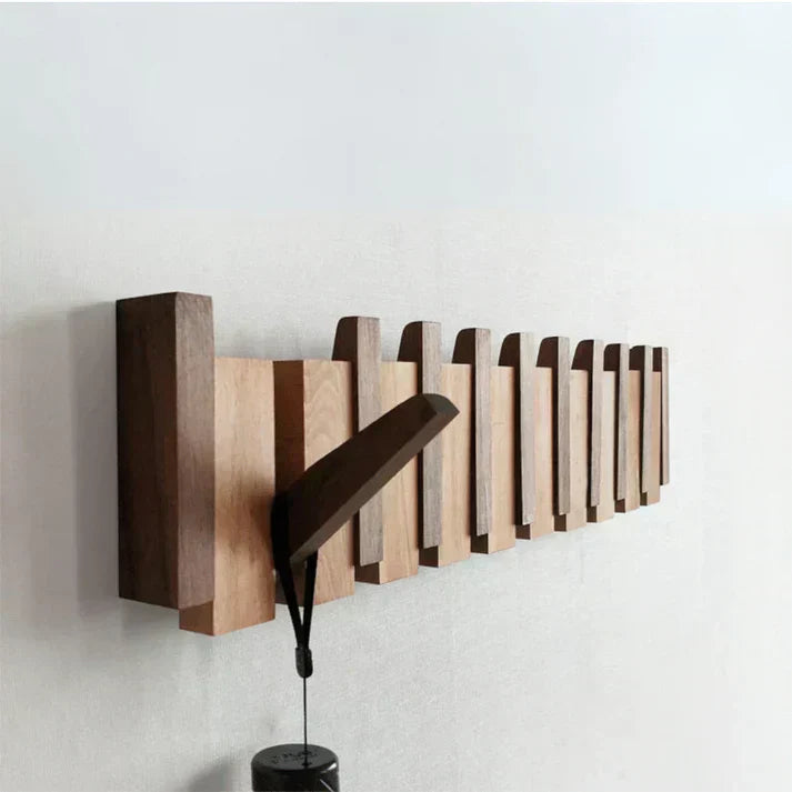Elegant wooden wall coat rack with fold-out hooks