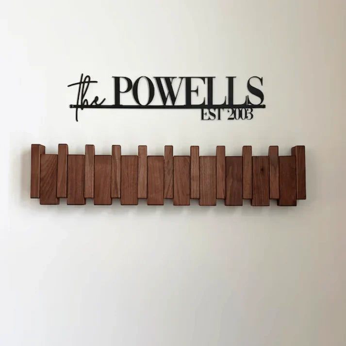 Elegant wooden wall coat rack with fold-out hooks