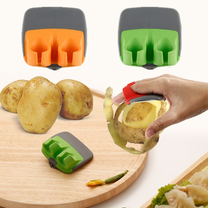 Vegetable and fruit peeler with double finger grip