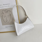Elegante Baguette-Tasche im stilvollen Schlangenlook