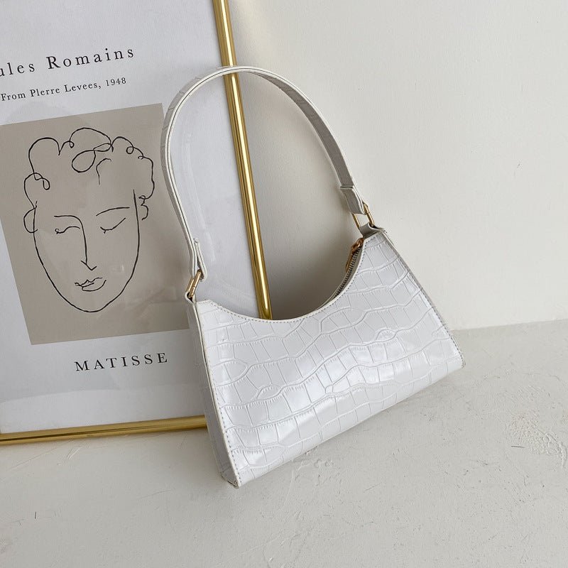 Elegante Baguette-Tasche im stilvollen Schlangenlook