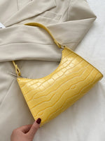 Elegante Baguette-Tasche im stilvollen Schlangenlook