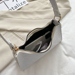 Elegante Baguette-Tasche im stilvollen Schlangenlook