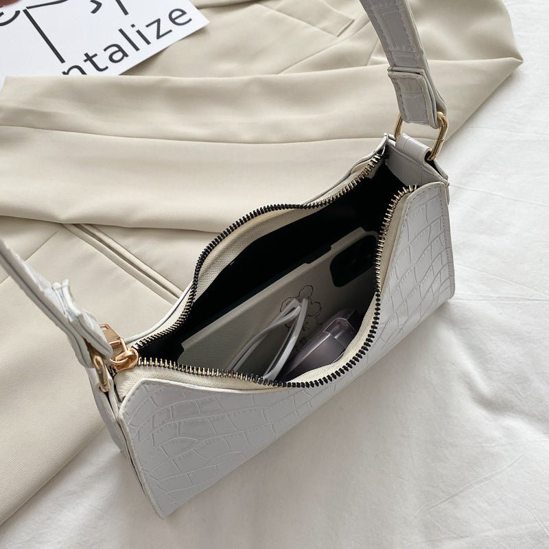 Elegante Baguette-Tasche im stilvollen Schlangenlook