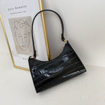 Elegante Baguette-Tasche im stilvollen Schlangenlook