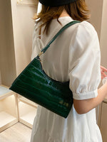 Elegante Baguette-Tasche im stilvollen Schlangenlook
